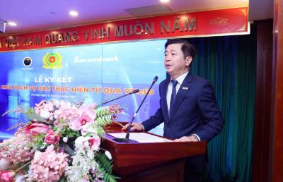 Phó Tổng Giám đốc Ngân hàng TMCP Sài Gòn Thương Tín (Sacombank) Nguyễn Minh Tâm phát biểu. Ảnh: Phạm Kiên - TTXVN