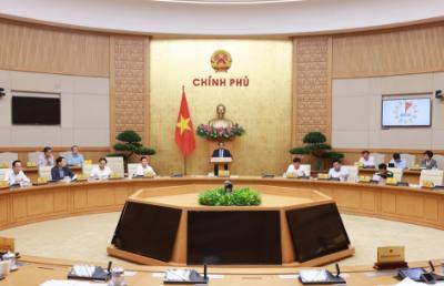 Thủ tướng Phạm Minh Chính chủ trì họp đánh giá kết quả vận hành mô hình chính quyền địa phương hai cấp. Ảnh: Dương Giang-TTXVN
