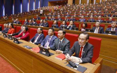 Đoàn đại biểu Đảng bộ Chính phủ dự phiên khai mạc Đại hội XIV của Đảng. Ảnh: TTXVN