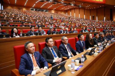 Đoàn đại biểu Đảng bộ Chính phủ dự phiên thảo luận tại hội trường về các văn kiện Đại hội, sáng 21/1. Ảnh: TTXVN